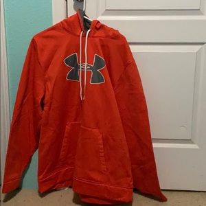 A orange under Armour sweatshirt
